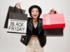 Black Friday 2026: Dates, Best Deals, and Shopping Tips Woman showing the items she bought during Black Friday shopping.