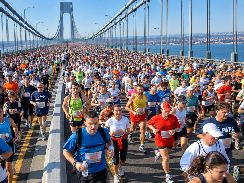 NYC Marathon course map showing the 26.2-mile route through all five boroughs, crossing the Verrazzano-Narrows, Queensboro, Willis Avenue, and Madison Avenue bridges before finishing in Central Park.